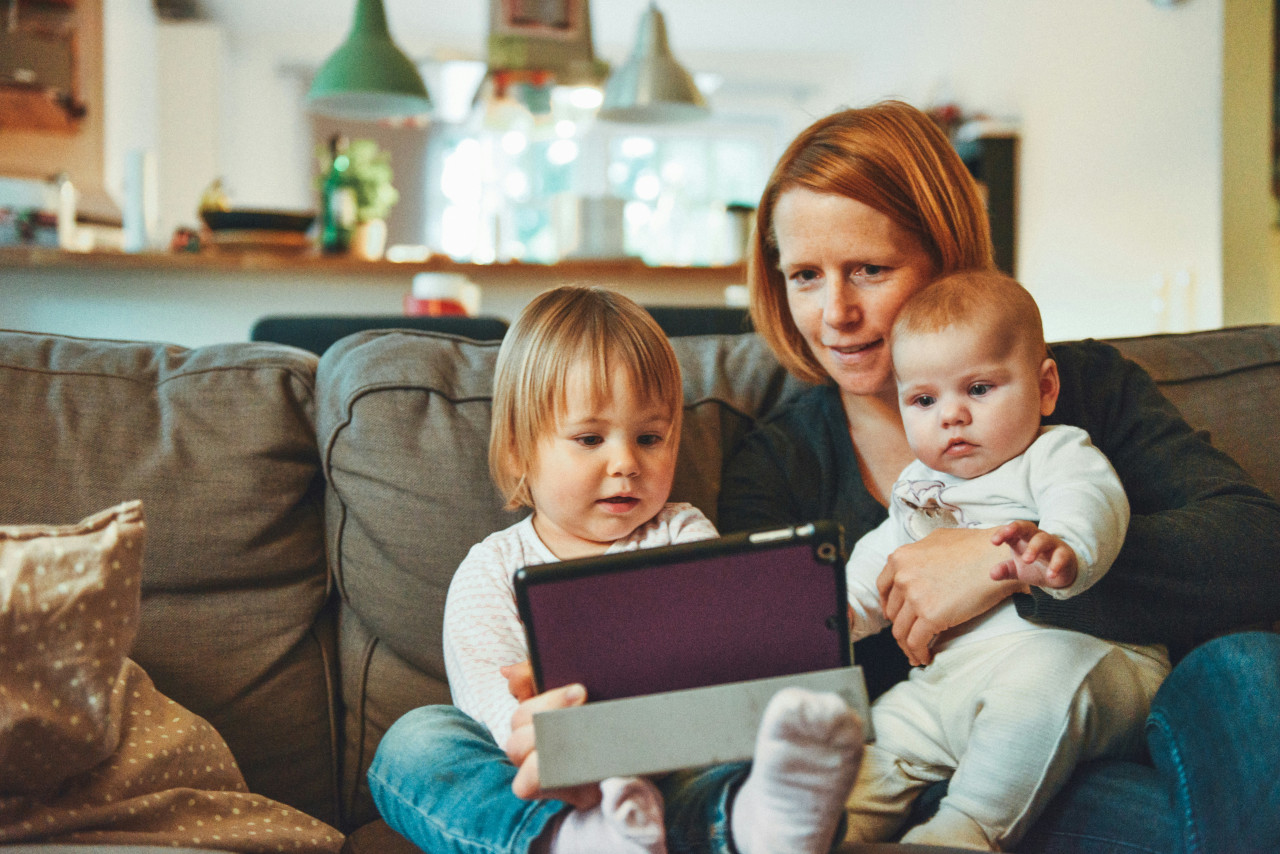 Family scene with a mother and two kids, representing the reasons to prioritize home air quality testing.